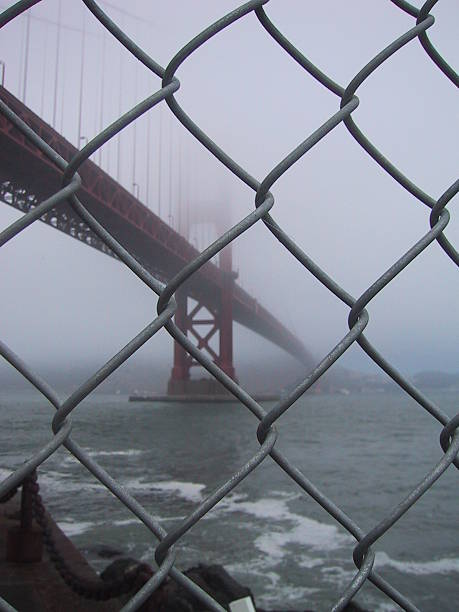 Golden Gate Bridge behind bars stock photo