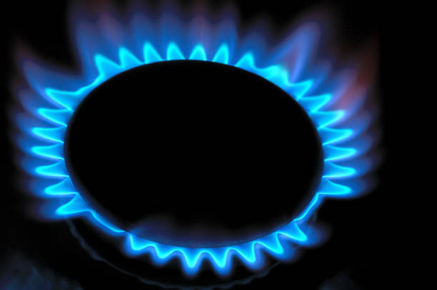istock gas burner with burning gas. dark background. 1396884327
