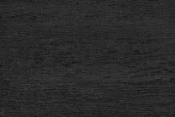 istock Black plywood surface texture. Dark wood grain backdrop. Abstract wooden pattern background 1396884366