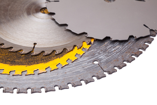 many circular saw blades on white background