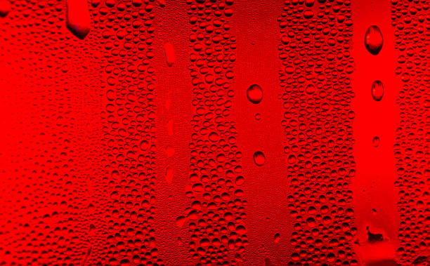 istock red macro water drop texture,Water drops on red background 1396888554