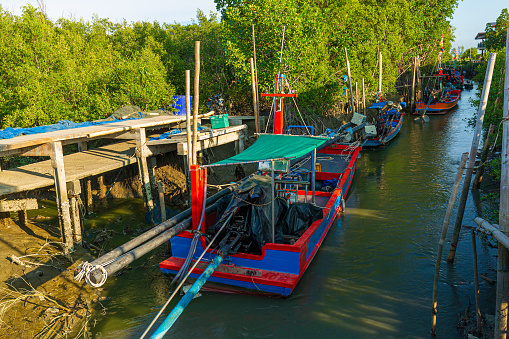 Small fishing boats in asia,Thai fishing boats docked at Samui beach, Thailand in a summy day