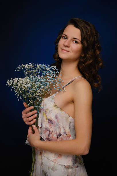 istock girl with flowers 1396890630