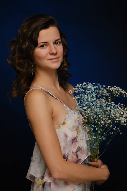istock girl with flowers 1396890632
