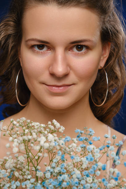 istock girl with flowers 1396890662