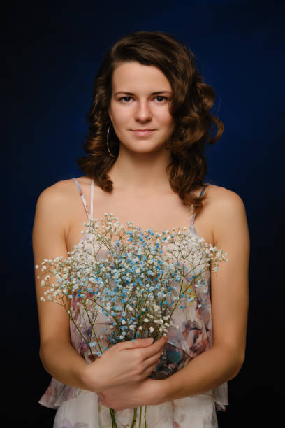 istock girl with flowers 1396890666