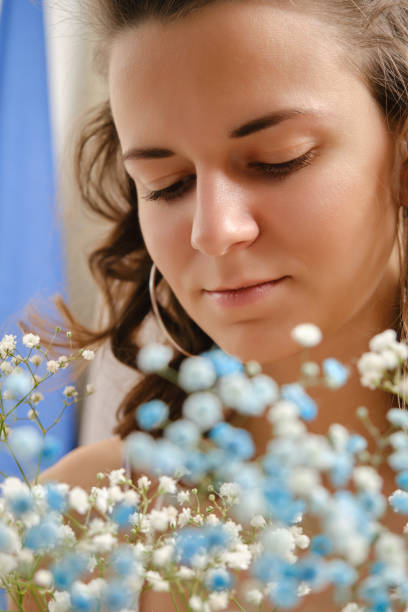 istock girl with flowers 1396890723