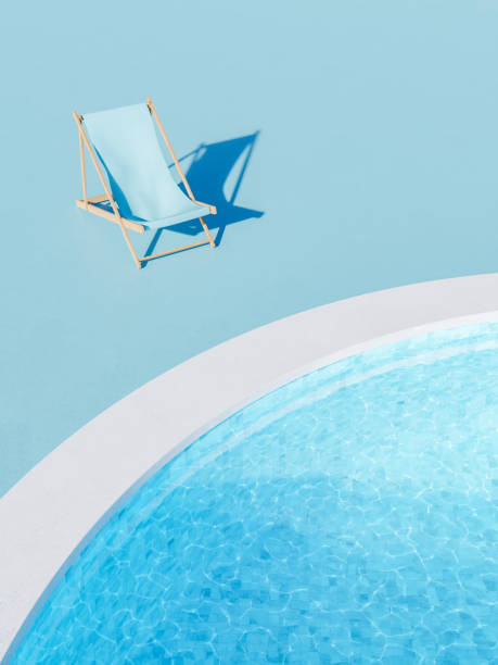 istock Deckchair placed at poolside on sunny day 1396891291