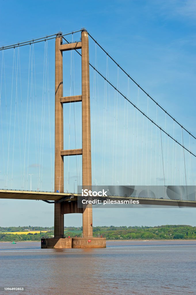 Humber Bridge vertical suspension tower The Humber Bridge, near Kingston upon Hull, East Riding of Yorkshire, England,  which opened in 1981 is 2.22 km long suspenson bridge and is the worlds longest single-span road suspension bridge that can also be crossed by foot or cycle, Architecture Stock Photo