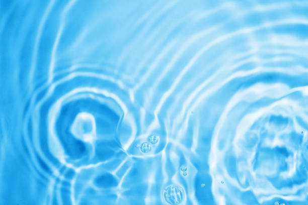 Blue water droplets on a white background
