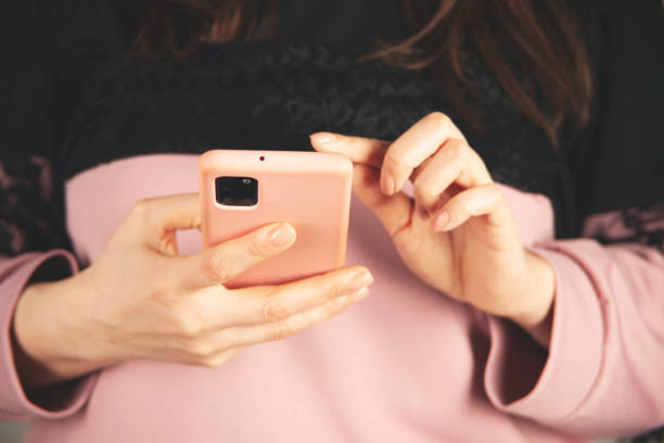 istock woman hand smart phone 1396895282