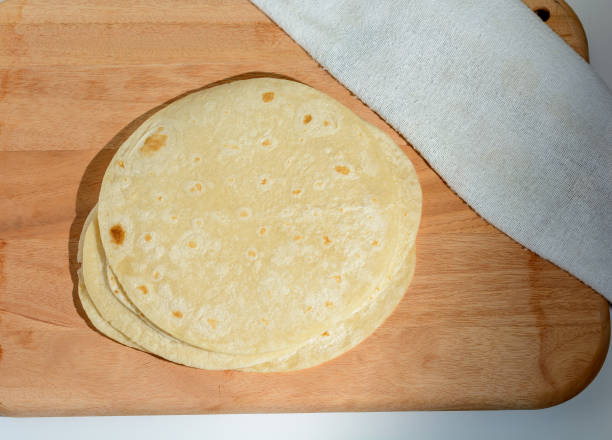istock Some tortillas on top of a kitchen board. 1396895312