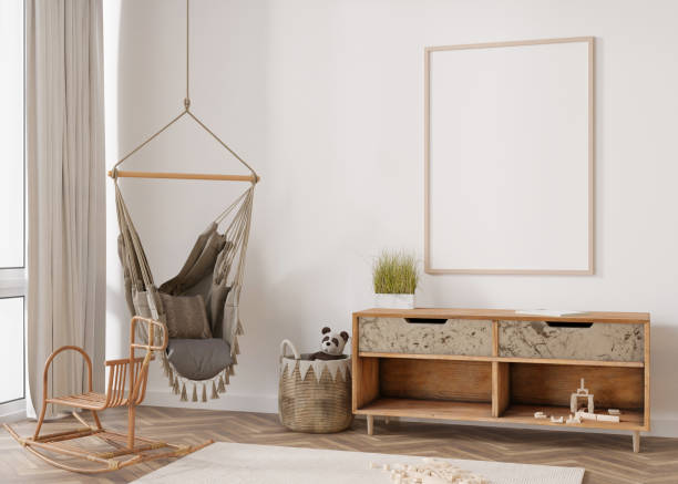 istock Empty vertical picture frame on white wall in modern child room. Mock up interior in scandinavian, boho style. Free, copy space for your picture. Rattan details. Cozy room for kids. 3D rendering. 1396895375