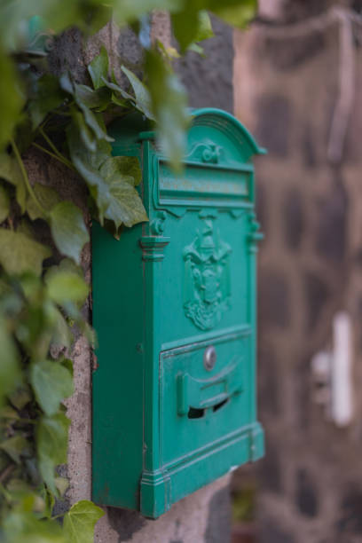 istock Close up of an antique mailbox, on brick wall 1396896250