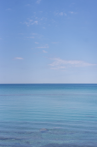 Horizon over calm, blue water