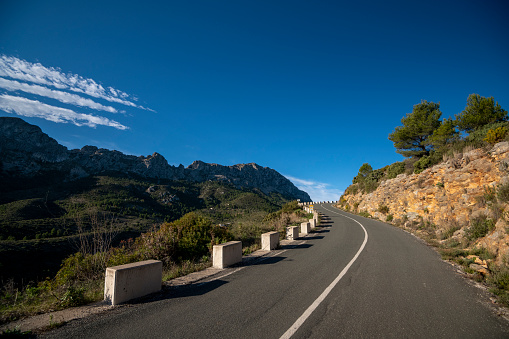 Winding mountain road between Jalon village and Bernia mountain, Marina Alta, Costa Blanca, Alicante Province, Spain