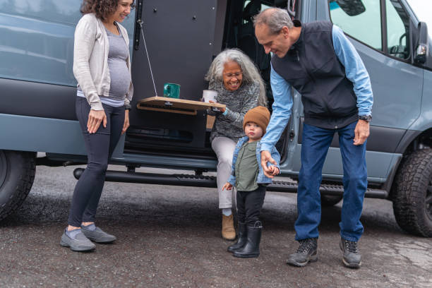 istock Multi-generation family on raod trip in camper van 1396900732