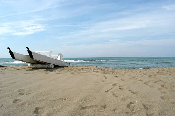 italian rowing-boat "pattino" on the beach in Forte dei Marmi, Tuscany.