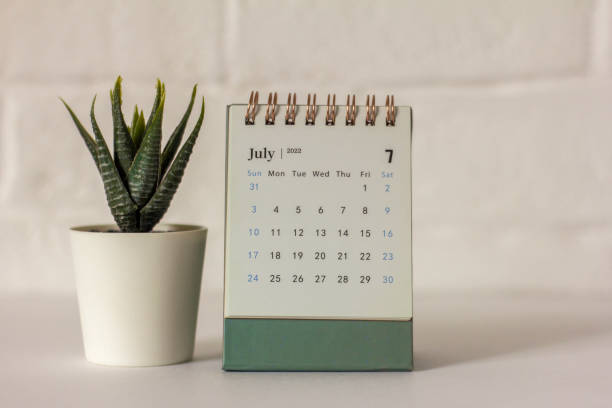 istock Desktop calendar for July 2022 on the table. 1396905617