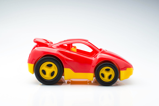 Children's toy car on background