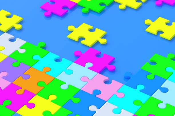 istock Many unfinished colorful puzzle jiggle pieces on blue background. 3d render 1396907192