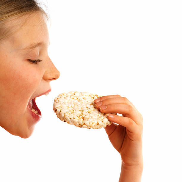 istock girl eating rice waffle 139690852