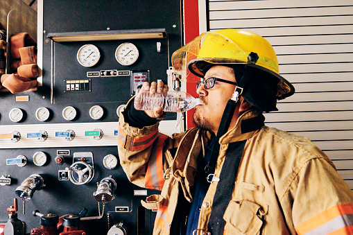 An Indigenous Navajo firefighter at a fire station.