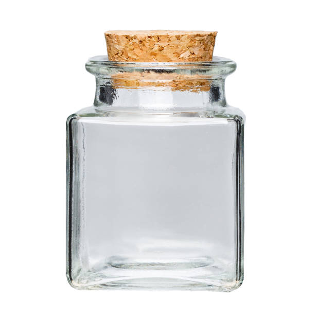 istock Transparent empty square glass jar on a white background with a cork lid 1396910039