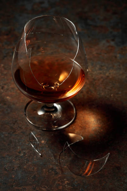 istock Brandy is in broken glass on a rusty background. 1396910927