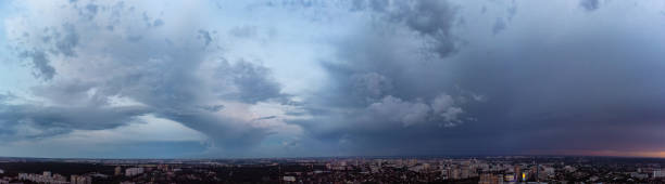 istock Aerial wide dramatic cloudscape above city view 1396911129