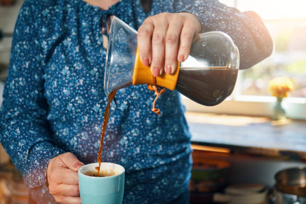 istock Making Fresh Brewed Coffee in Domestic Kitchen 1396913350