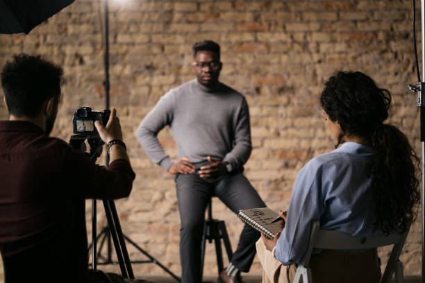 istock Female journalist interviewing a handsome young man 1396913471