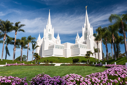 Tongatapu island, Tonga: Mormon temple - Church of Jesus Christ of Latter-day Saints - Tonga is the number one country in the world for Mormonism, on a per capita basis (over 60%) - Nuku'alofa's main temple, located near Matangiake on Loto Road - Nuku'alofa Tonga Temple / Liahona (formerly the Tongan Temple), built with a modern single-spire design with the angel Moroni - architect Emil B. Fetzer, LDS church.