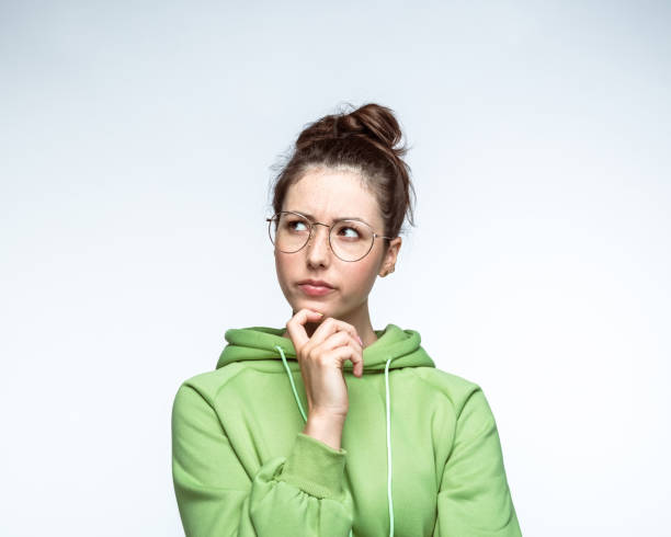 istock Confused woman over white background 1396914746