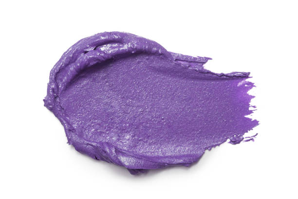 istock Purple clay face mask stroke isolated on white 1396914795