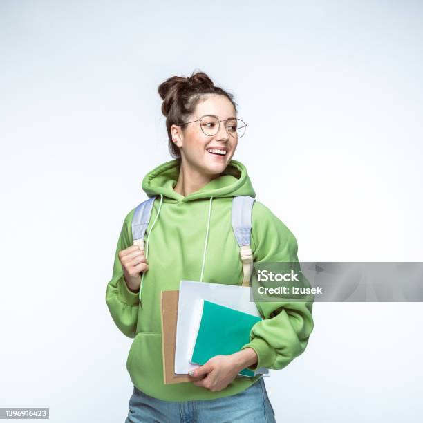 Smiling Woman With Books And Backpack Stock Photo - Download Image Now - Smiling, Student, White Background