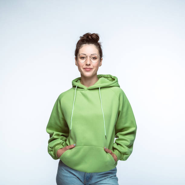 Woman standing with hands in pockets