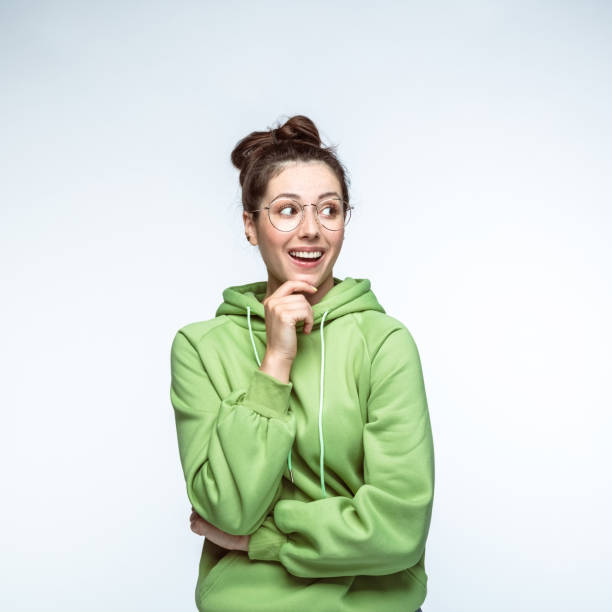 istock Woman with hand on chin looking away 1396917599
