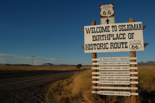 This sign is in Seligman, AZ.  Nothing but desert roads in front of it... nothing but desert roads behind it.