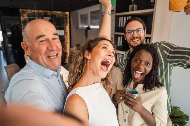 istock Business people taking selfies on their break from work 1396919585