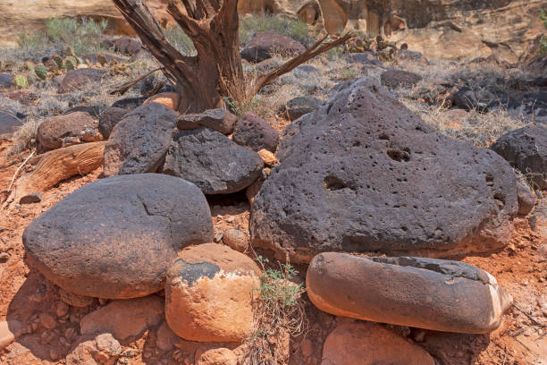 istock Volcanic Rocks in a Sandstone Desert 1396919819