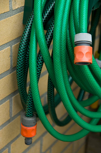 Green garden hoses stock photo