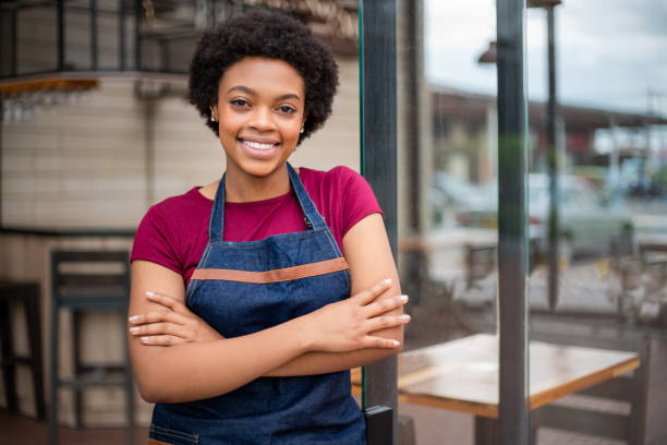 istock Happy waitress working at a cafe 1396921724