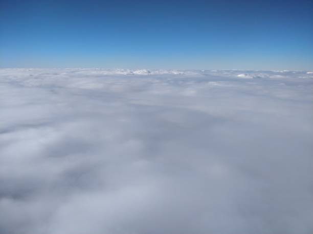 istock Flying over a sea of clouds 1396921795