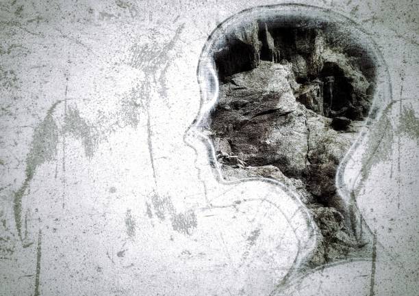 istock Silhouette illustration of an abstract person's profile drawn on a concrete wall 1396922057