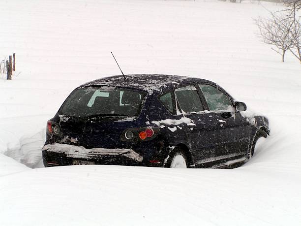 istock car buried in a snow storm 139692229