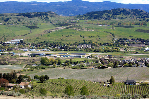 High angle view of Vernon BC small Regional Airport.  Surrounded by Vineyards,Orchards, and Tree Farms. Photographed in Spring. May.