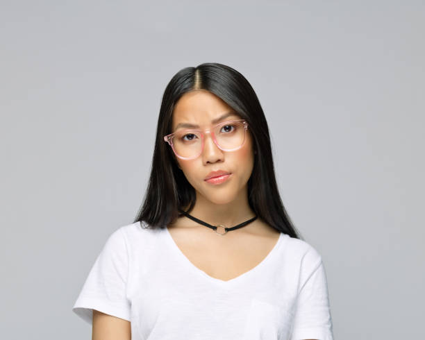 istock Confident woman against gray background 1396927126