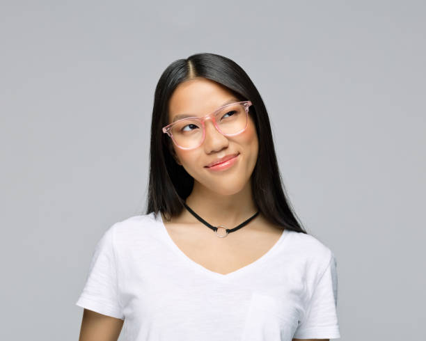 istock Confused woman against gray background 1396927739