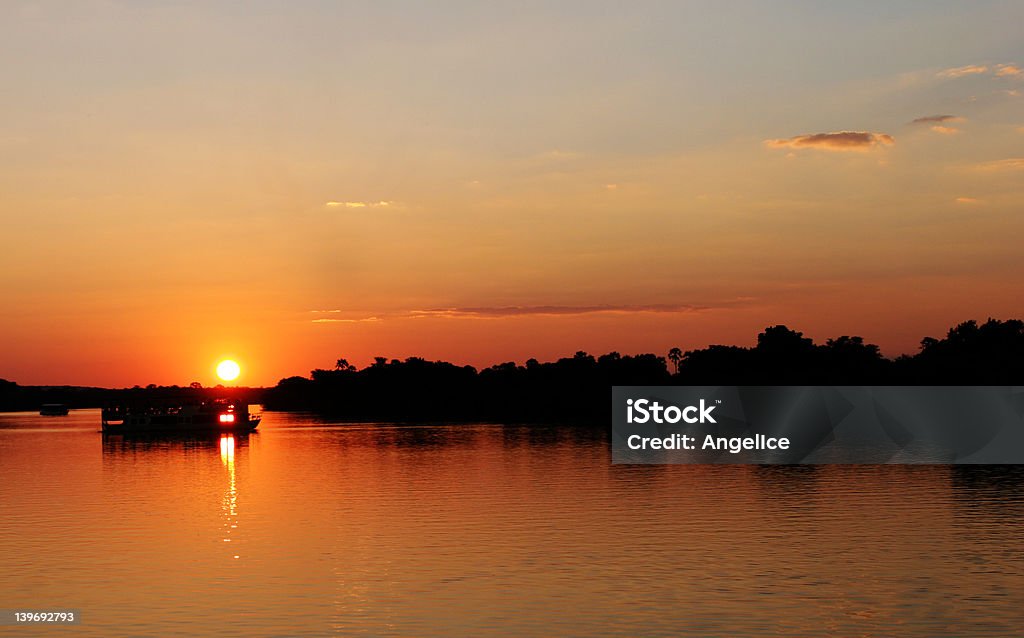 Sunset in Zimbabwe over Zambezi river Sunset in Zimbabwe Arts Culture and Entertainment Stock Photo